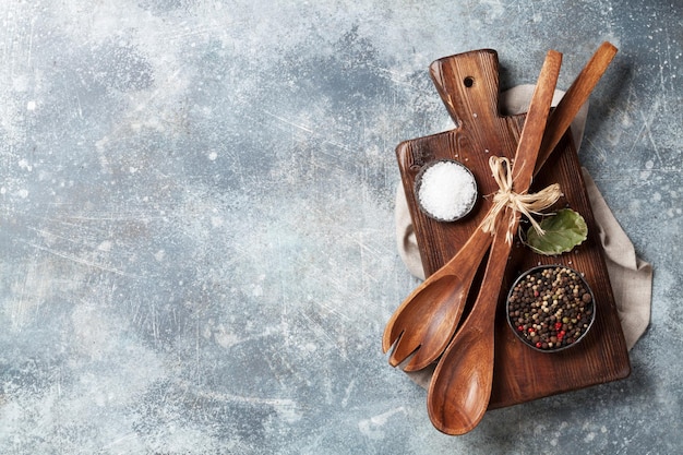 Assorted spices and utensils on wooden table